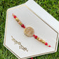 Rakhi with vibrant threads by Creative Jewels